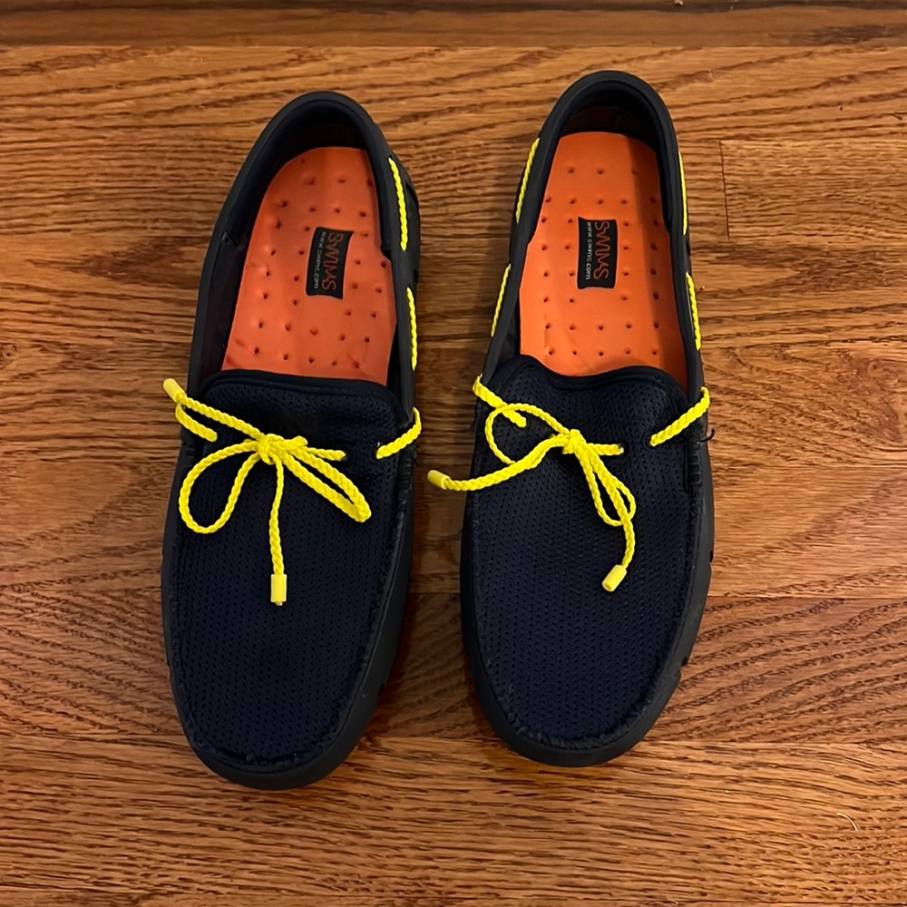 Men’s Motion Knit Chukka Sneaker Navy with yellow bottoms and braided laces.